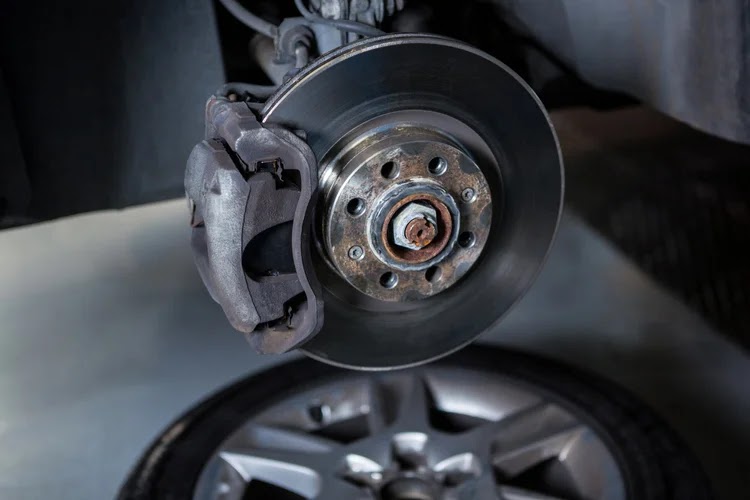 Vehicle brake rotor and caliper during service