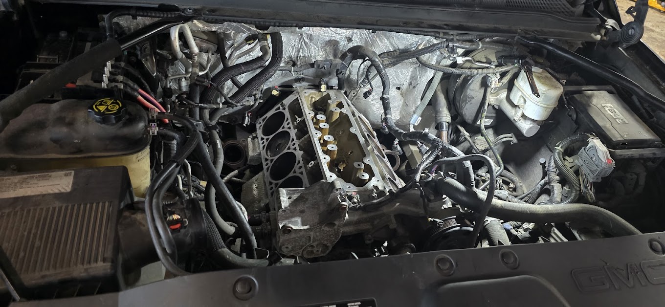 Engine bay with intake removed for repair