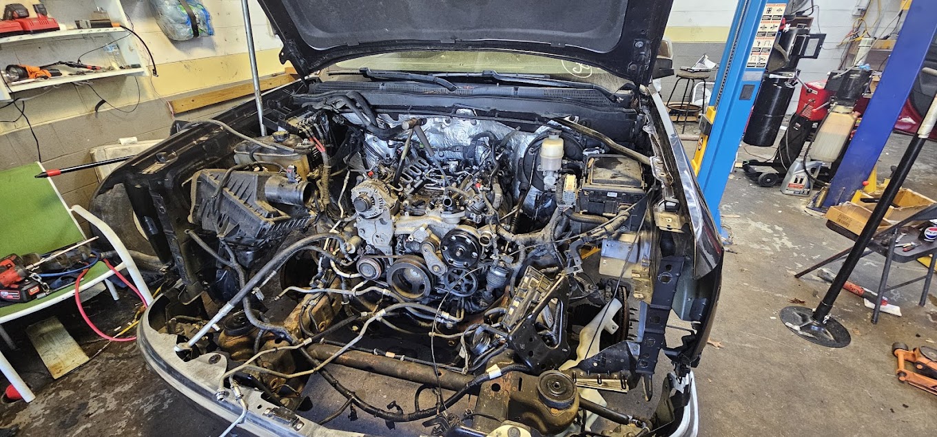 Vehicle engine bay during repair work