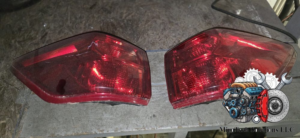 Nissan Pathfinder tail light assembly, driver side (photo shows the pair)