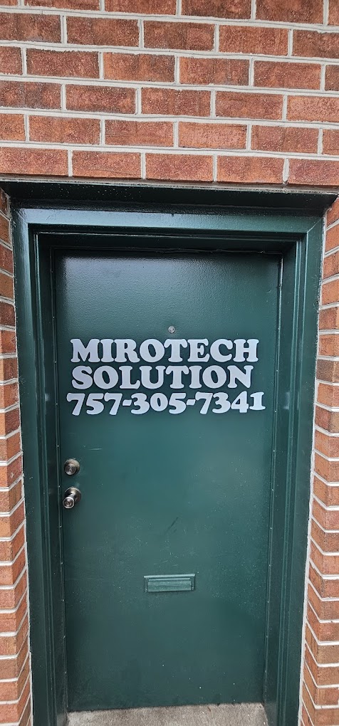 Green door with MiroTech Solution phone number